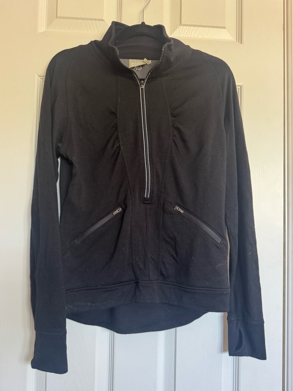 Athleta- Black Half-Zip Sweatshirt with Zip Front Pockets.